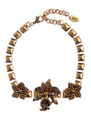 Collana con catena effetto borchie e tralcio di fiori centrale in ottone